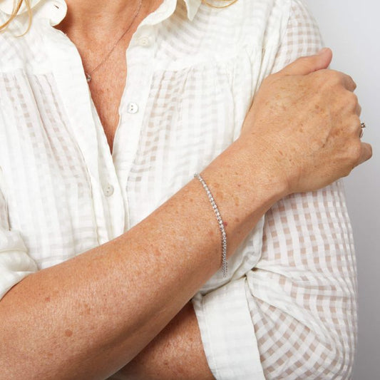 Woman wearing an Elegant Mini Diamond and White Gold Tennis Bracelet