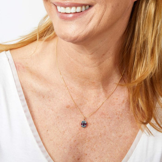 Model wearing Barcelona Cluster Pendant in 9ct Gold gp2361, featuring a stunning cluster of sparkling gemstones set in polished 9ct gold, perfect for adding elegance and sophistication to any outfit.