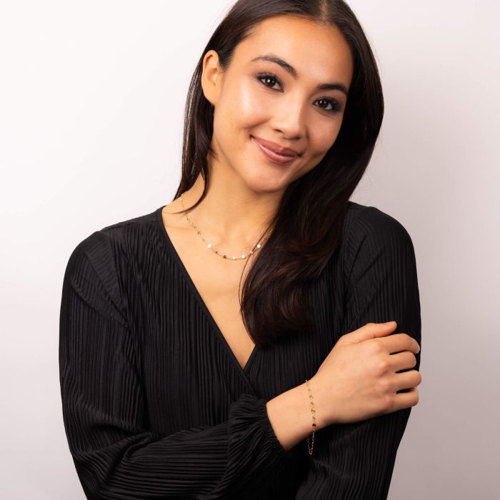 Model wearing Discs and Chain Necklace and Bracelet Set in 9ct Gold gn394 and gb525, featuring sleek chains with decorative discs, perfect for stylish accessories and coordinated jewelry looks.