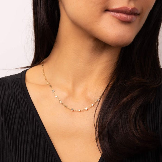 Model wearing Discs and Chain Necklace in 9ct Gold gn394, featuring a sleek chain design with decorative discs, perfect for elegant everyday wear and versatile styling.