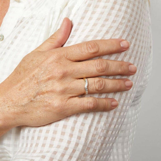 Model wearing Double Wave Diamond Set Ring in 9ct Gold gr629, featuring an elegant wave-inspired design with sparkling diamond accents set in polished 9ct gold, perfect for adding sophistication and timeless beauty to any outfit.