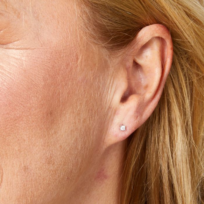 Ear with a Mini White Gold Diamond Stud Earring