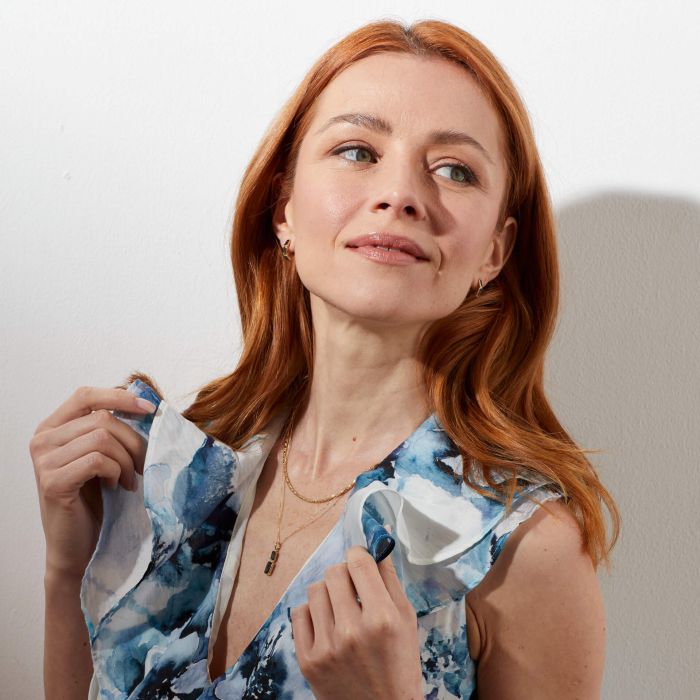 Front view of model wearing Elongated Gold Pendant Topaz Necklace