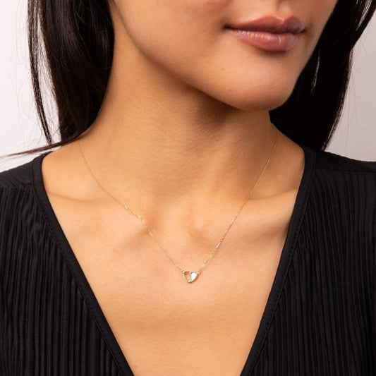 Model wearing Half Mother of Pearl Inlay Heart Pendant Necklace in 9ct Gold gn391w, featuring a beautiful heart-shaped pendant with half mother of pearl inlay set in polished 9ct gold, perfect for adding elegance and sophistication to any outfit.