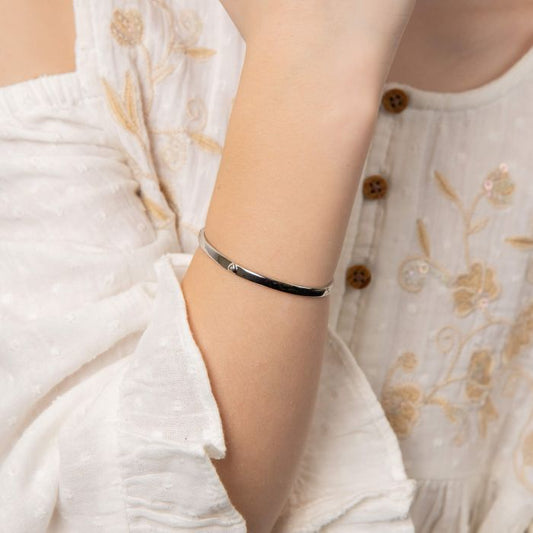 Child wearing Heart Motif Hinged Maiden Bangle with Diamond b5482, featuring a delicate heart motif design with a sparkling diamond accent and a secure hinged closure, perfect as a timeless keepsake for babies and children.