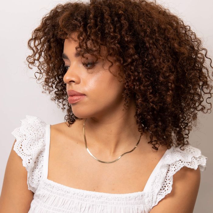 Model wearing Herringbone Chain Necklace in 9ct Gold gn377, featuring a sleek and elegant herringbone design, perfect for stylish everyday wear or special occasions.