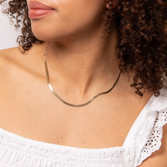 Model wearing Herringbone Chain Necklace in 9ct Gold gn377, featuring a sleek and elegant herringbone design, perfect for stylish everyday wear or special occasions.