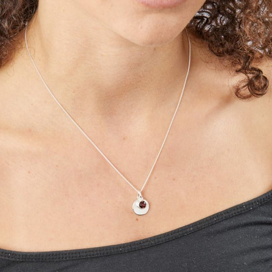 Model wearing January Birthstone Necklace with Engravable Disc in Sterling Silver, elegant pendant with a minimalist design, perfect personalized jewelry gift.