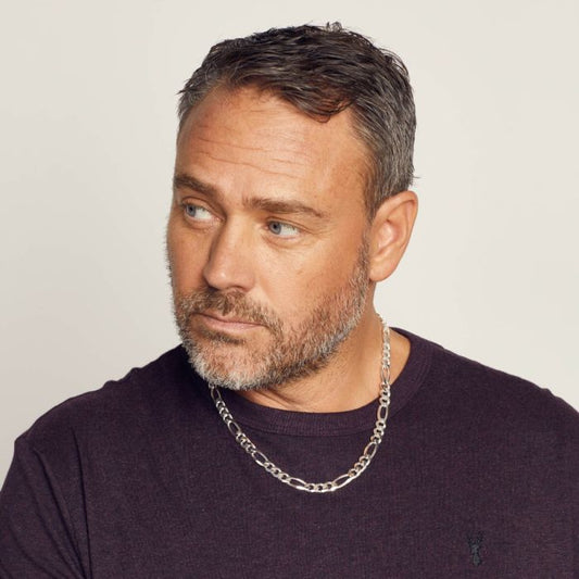 Male model wearing Men’s Heavyweight Figaro Silver Chain Necklace n4533, featuring a bold and durable Figaro link design crafted in solid sterling silver, perfect for adding a stylish and masculine touch to any outfit.