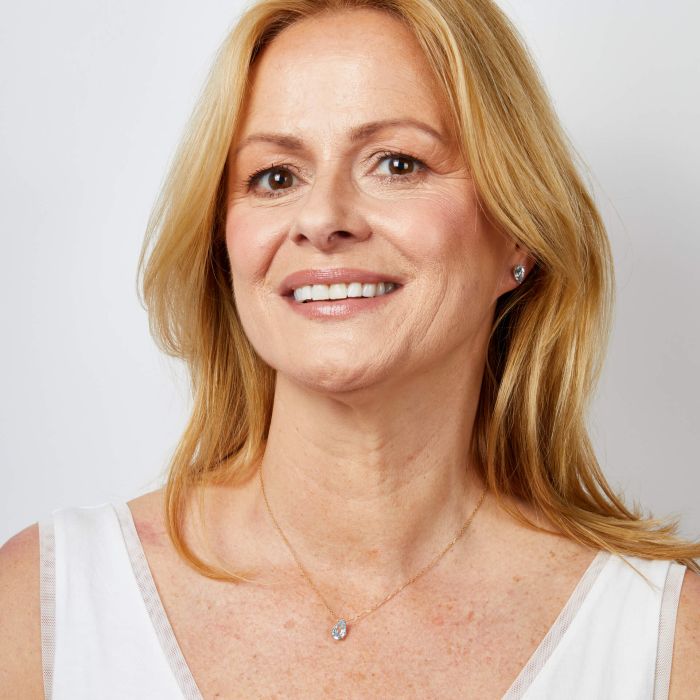 Model wearing Pear Fancy Cut Topaz Stud Earrings in 9ct Gold ge2486t paired with matching Pear Fancy Cut Topaz Necklace gn409t, featuring stunning pear-shaped topaz gemstones set in polished 9ct gold, perfect for a coordinated and elegant jewelry look.