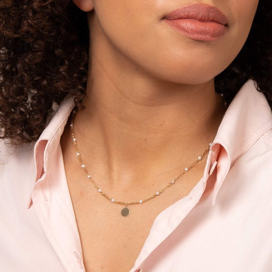 Close-up of Model wearing Pearl Station Necklace with Engravable Disc in 9ct Gold gn387w, elegant personalized jewelry featuring pearls and a custom disc, perfect for gifts or special occasions.