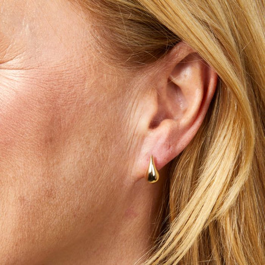 model ear wearing Plain Teardrop Stud Earrings in 9ct Gold close up