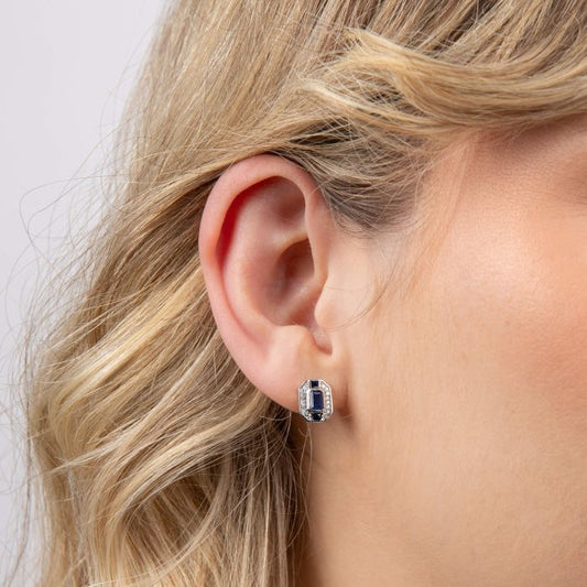 Model wearing Sapphire Channel and Diamond Stud Earrings in 9ct Gold ge2474l, featuring deep blue sapphires set in a sleek channel design with sparkling diamond accents, perfect for adding elegance and sophistication to any outfit.