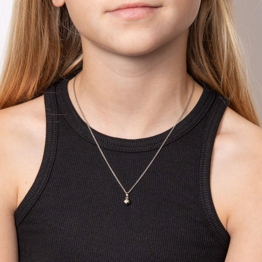 Child model wearing silver with diamond star sparkle pendant necklace IMG_0034, featuring a delicate star-shaped design crafted in polished silver with a sparkling diamond accent, perfect for adding charm and elegance to a young jewelry collection.