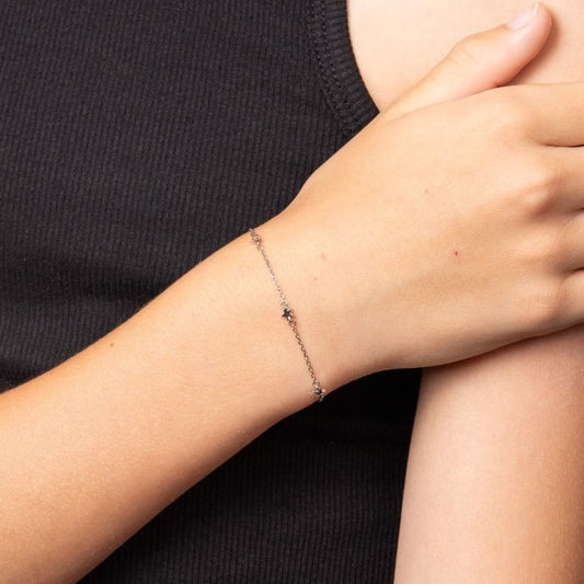 Child model wearing Star Station Bracelet with Diamond b5543, featuring a delicate star-themed design with sparkling diamond accents set in polished silver, perfect as a timeless and elegant jewelry piece for children.