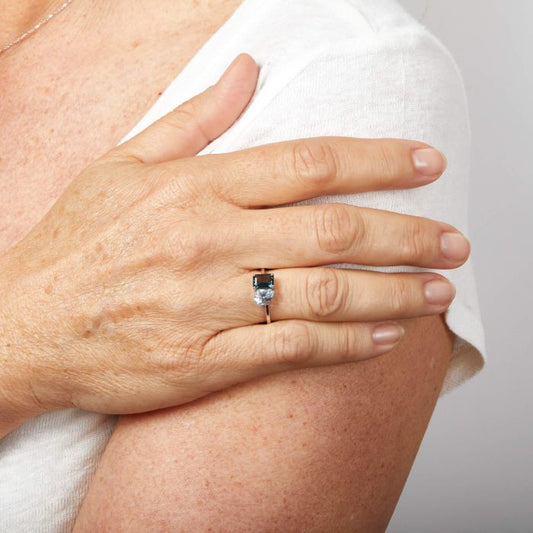 Model wearing Toi et Moi Blue Topaz Ring in 9ct Gold gr631, featuring elegant blue topaz gemstones set in polished 9ct gold, perfect for adding a touch of sophistication and timeless beauty to any outfit.