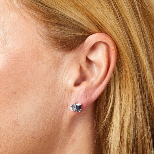 Model wearing Toi et Moi Blue Topaz Stud Earrings in 9ct Gold ge2473, featuring elegant blue topaz gemstones set in polished 9ct gold, perfect for adding a touch of sophistication and timeless beauty to any outfit.