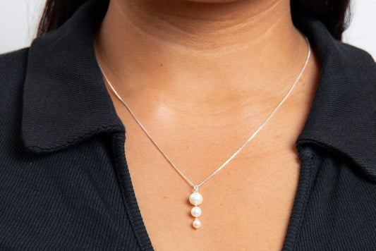 Gradient Freshwater Pearl Pendant silver necklace worn by a person against a white background
