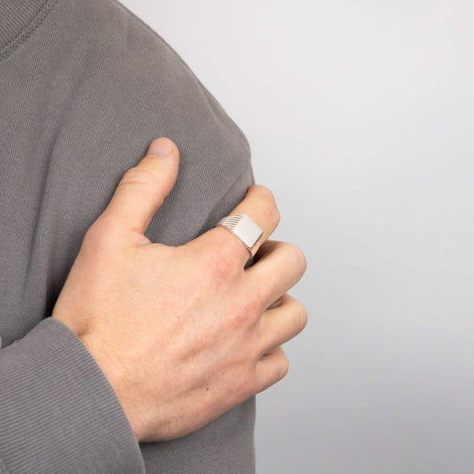 man hand wearing silver Square Signet Ring with Ridged Sides
