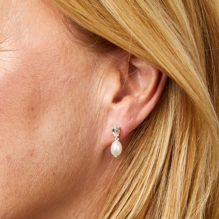 Model wearing Baroque Pearl and Topaz Drop Earrings in 9ct Gold ge2493w, featuring lustrous baroque pearls paired with sparkling topaz gemstones set in polished 9ct gold, perfect for adding elegance and sophistication to any outfit.