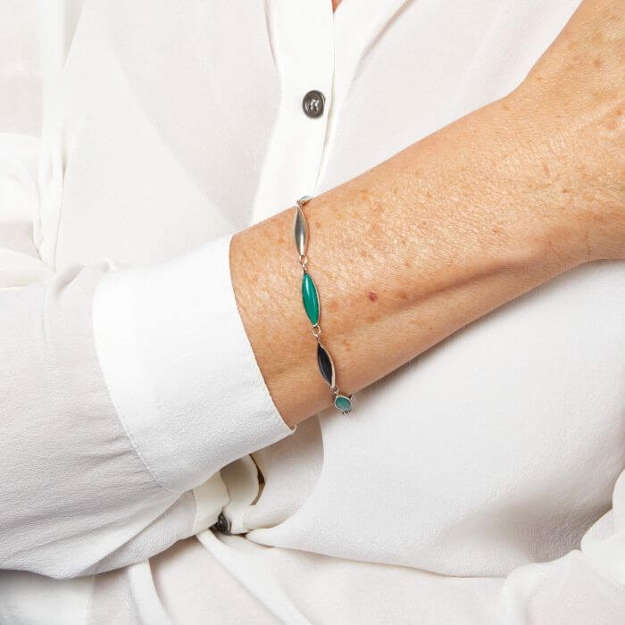 Model wearing Fiorelli Elongated Navette Onyx Bracelet b5517g, featuring a sleek elongated navette-shaped onyx stone design with silver accents, perfect for adding sophistication and modern elegance to any outfit.