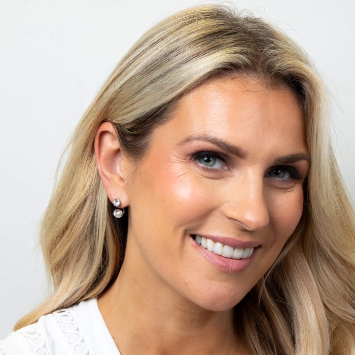 Model wearing Fiorelli Front and Back Earrings with Oval and Round Crystal Shapes e6462c, featuring a versatile design with sparkling oval and round crystals, perfect for customizable and elegant jewelry styling.