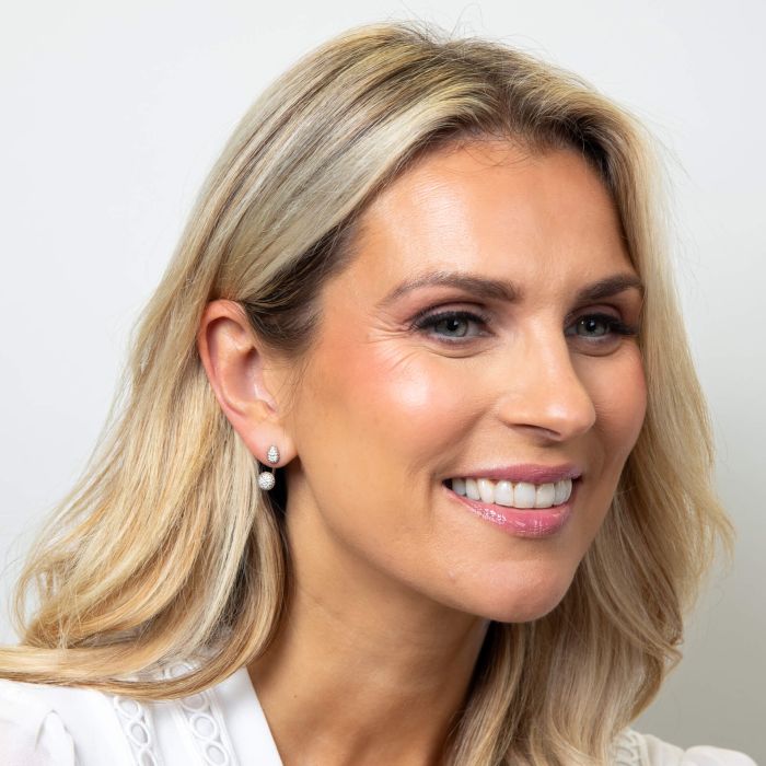 Model wearing Fiorelli Front and Back Earrings with Pave Droplet and Round Shapes e6463c, featuring a versatile design with sparkling pave droplet and round crystals, perfect for customizable and elegant jewelry styling.