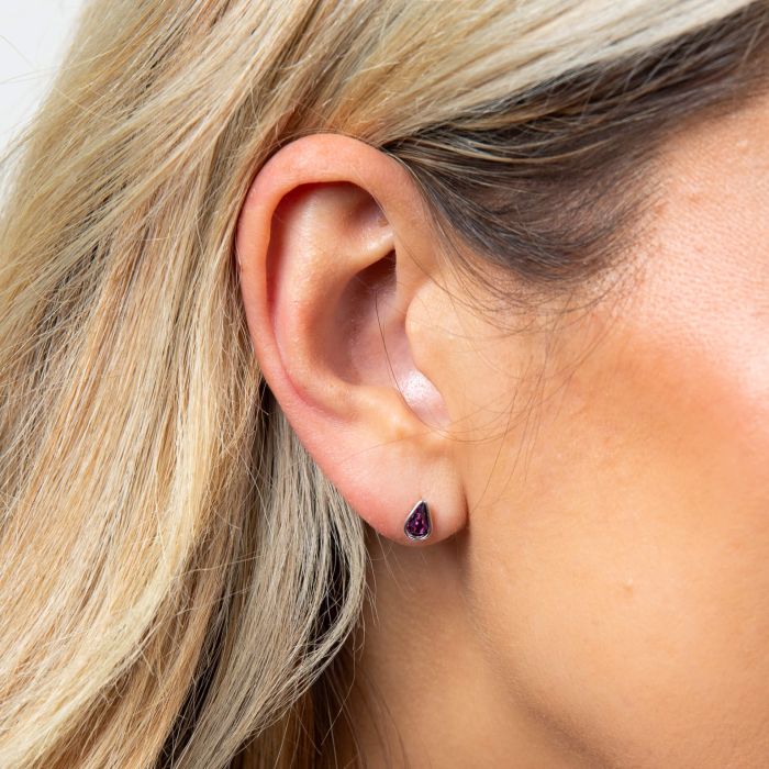Model wearing Fiorelli Front and Back Earrings with Pear stud earring 