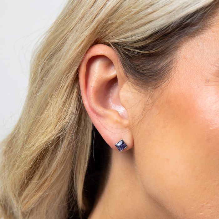 Model wearing Fiorelli Front and Back Earrings with Square and Round Crystal Shapes e6508 stud featuring a versatile design crafted from sterling silver with sparkling crystals, perfect for customizable and elegant jewelry styling