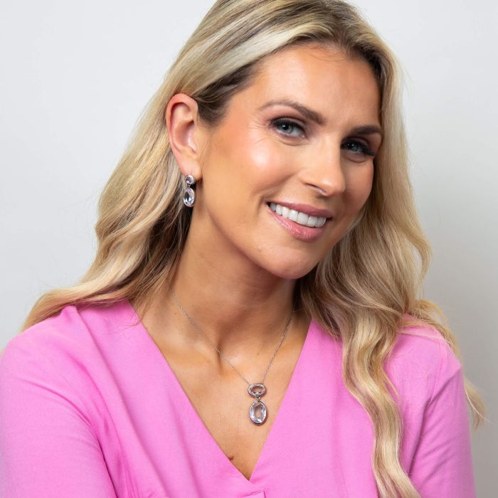 Model wearing Fiorelli Show Stopper Oval Drop Earrings e6506c paired with Necklace n4621c, featuring a striking oval drop design with sparkling cubic zirconia accents, perfect for creating an elegant and statement jewelry look.