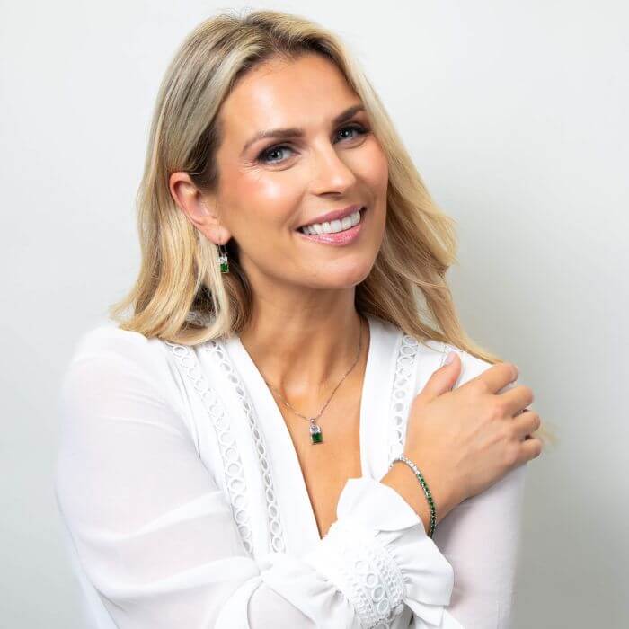 Model wearing Fiorelli Toi et Moi Bracelet b5541 paired with matching earrings and necklace set, featuring an elegant intertwined design with sparkling cubic zirconia accents, perfect for a sophisticated and coordinated jewelry look.