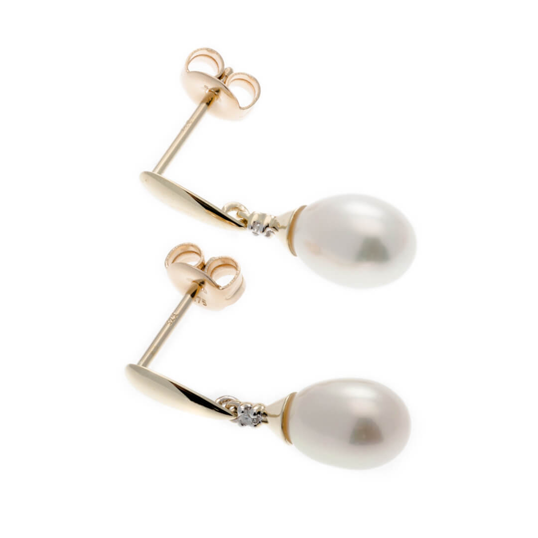 Gold Freshwater Pearl & Diamond Drop Earrings on white background sideway 