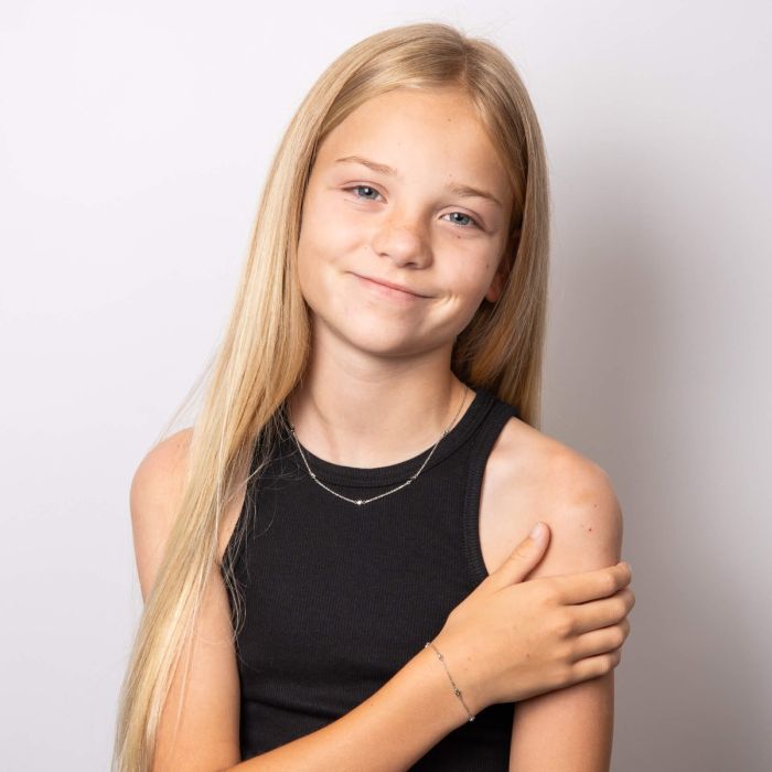 Child model wearing Star Station Bracelet with Diamond b5543 paired with Necklace n4622, featuring a delicate star-themed design with sparkling diamond accents set in polished silver, perfect as a timeless and elegant jewelry piece for children.