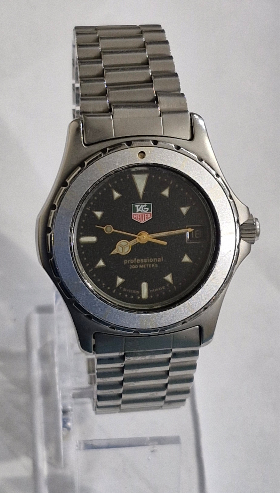 Tag Heuer 2000 Professional quartz dive watch from the 1990s, featuring a blue bezel, blue sparkle dial, and original oyster bracelet, priced at £650.