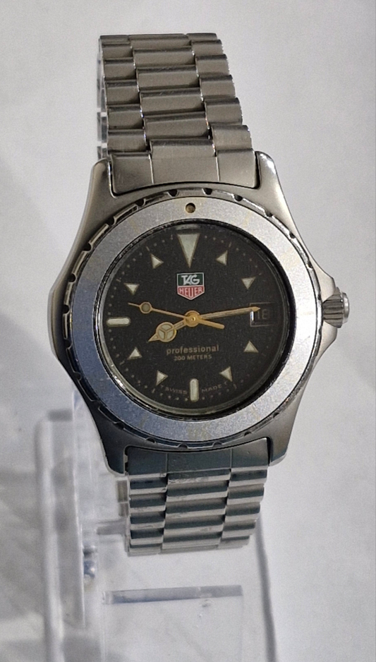 Tag Heuer 2000 Professional quartz dive watch from the 1990s, featuring a blue bezel, blue sparkle dial, and original oyster bracelet, priced at £650.