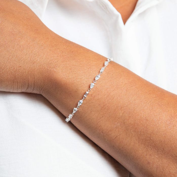 Mixed Shapes Tennis silver Bracelet on a person's wrist against a white background