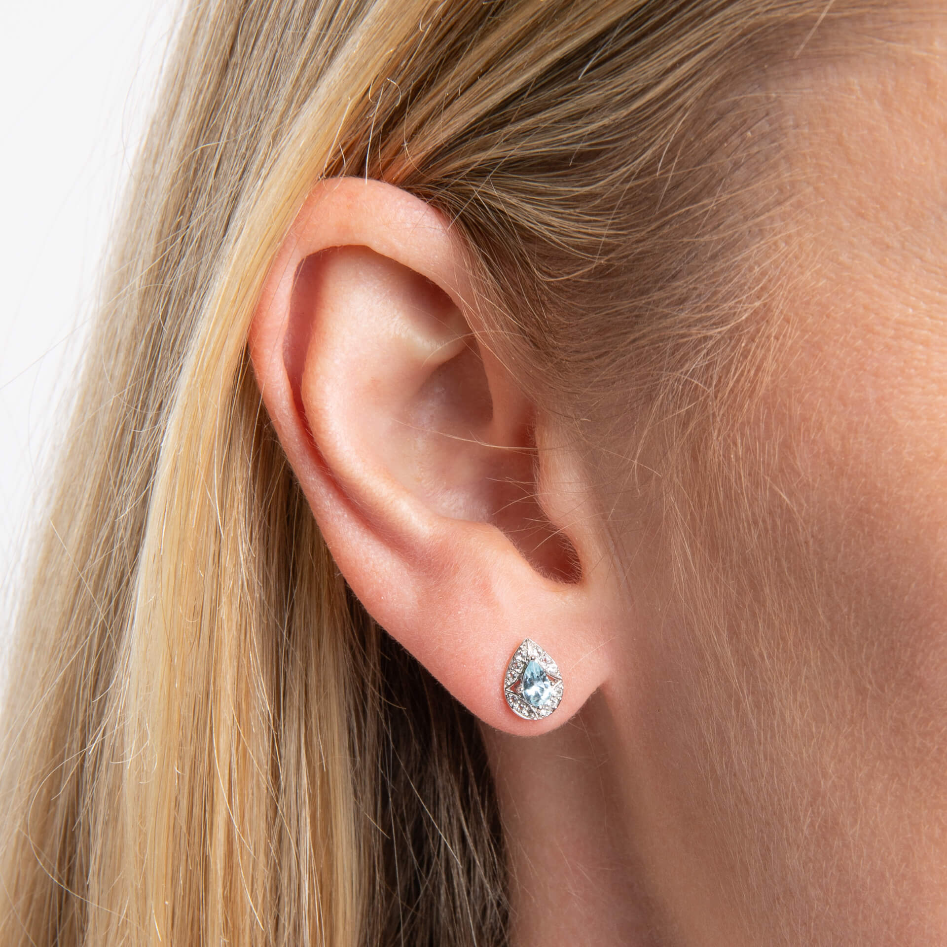 close up of ear 9ct White Gold Aquamarine & White Topaz Art Deco stud earring