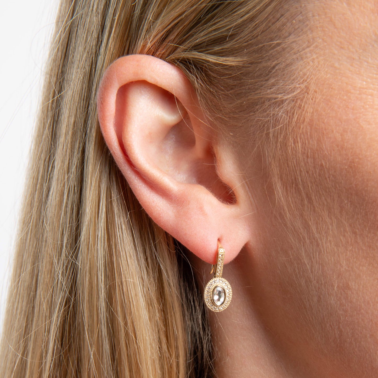close up of ear wearing Oval Blue Moonstone and White Topaz Drop Earrings