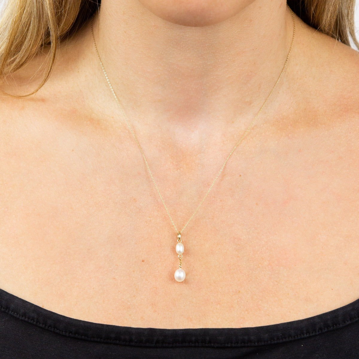 close up of woman neck wearing 9ct Gold Freshwater Pearl Tier Drop Pendant necklace 