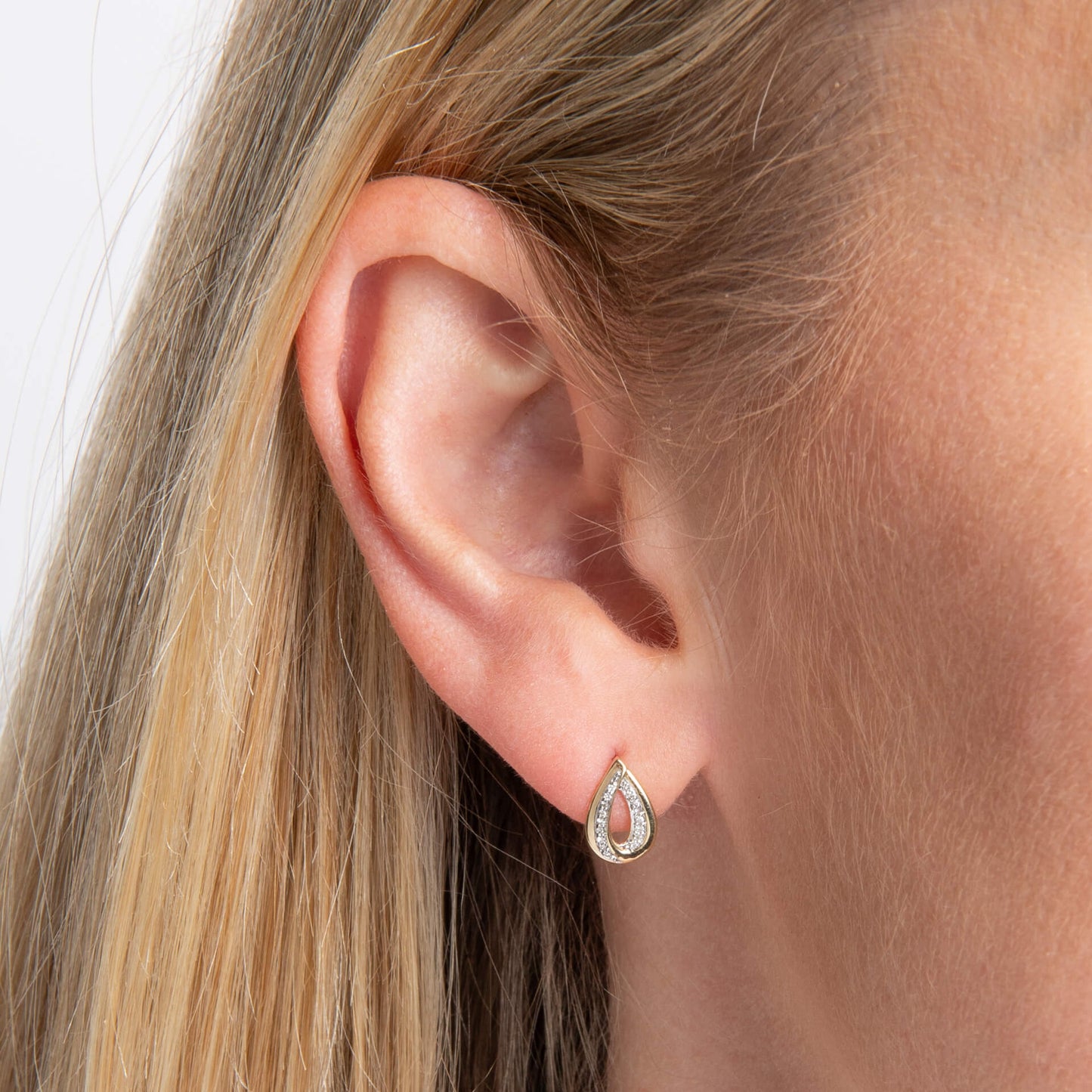 ear wearing Gold Cut Out Diamond Teardrop stud earring 