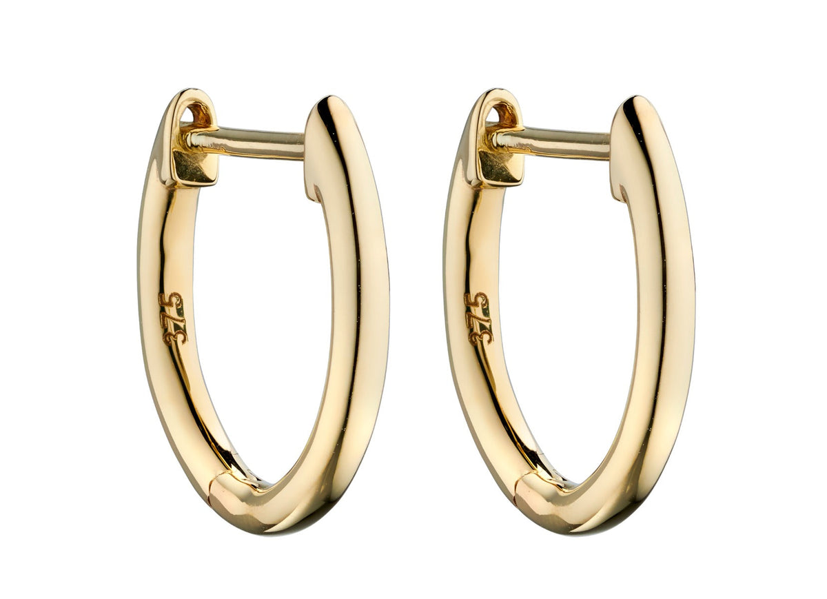 gold hoop Huggie earring on white background