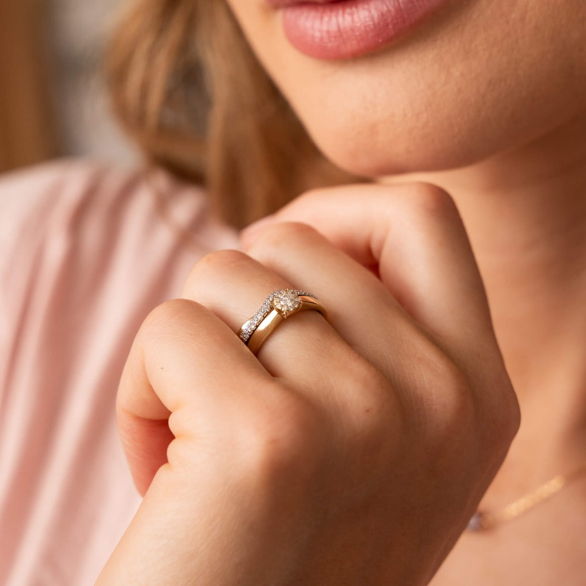 hand wearing Double Wave Diamond Set Gold Ring with solitaire ring showing how well the rings sit together. by Silverage London jewellers 