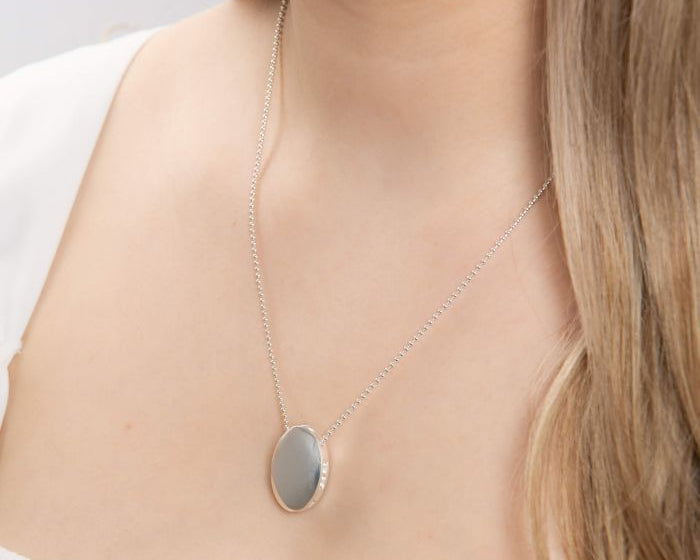 Statement High Polished Oval Silver Necklace worn by a person on a neutral background