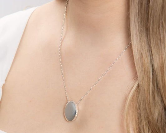 Statement High Polished Oval Silver Necklace worn by a person on a neutral background