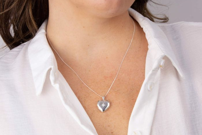 person werin Starburst Heart Locket Pendant silver necklace 