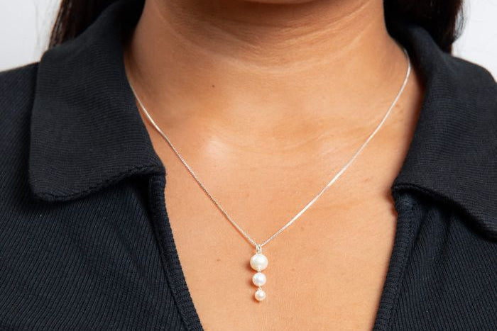Gradient Freshwater Pearl Pendant silver necklace worn by a person against a white background