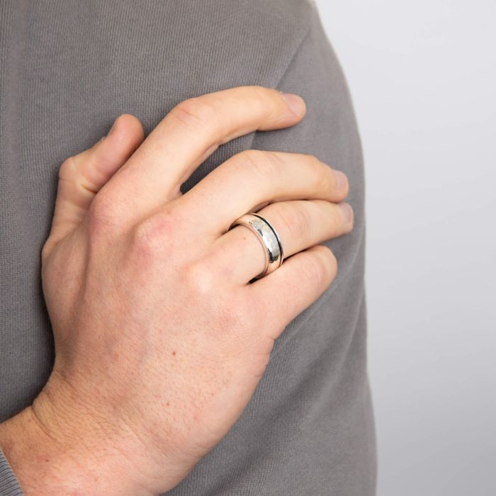 men hand wearing Hammered Design Silver Spinner Ring