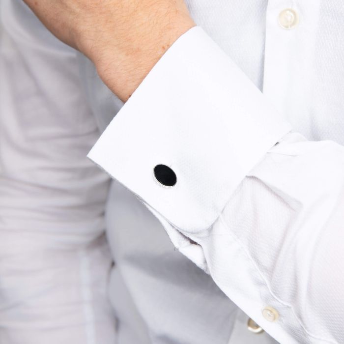 men arm with shirt sleeve wearing silver black onyx cufflink 