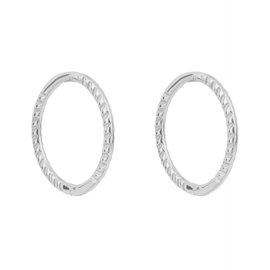 Pair of white gold rope hoop earrings on a white background