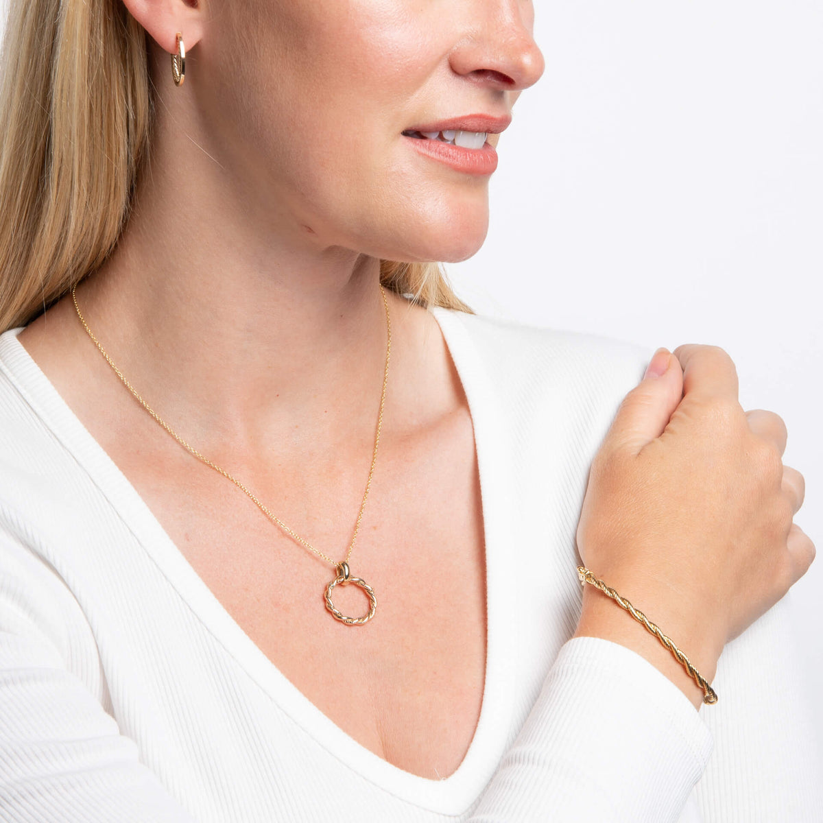 woman wearing 9ct Gold Rope Twist Bangle gold necklace and gold hoop earring 